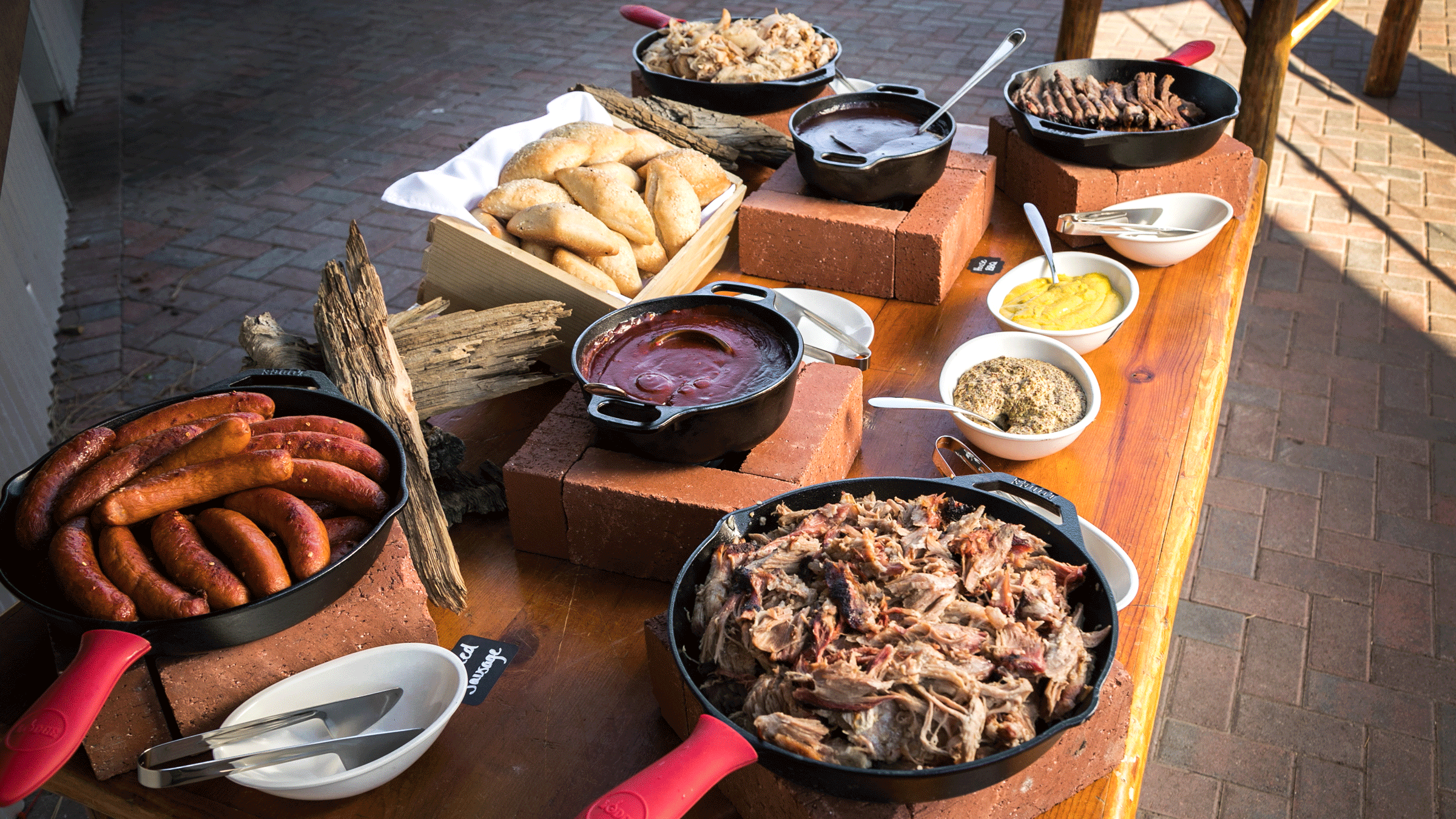 Meat table display with dipping sauces for a buffet